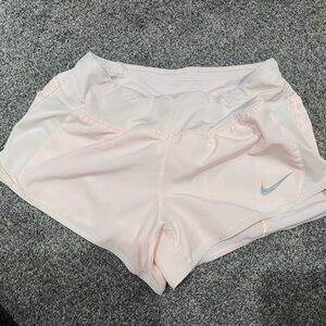 Blush pink Nike running shorts